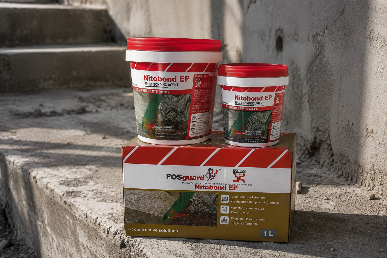 Fosroc Nitobond EP epoxy bonding agent tubs and 1L box on concrete steps

