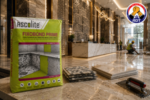 Ascolite Fixobond Prime non-slip adhesive holding a large stone tile