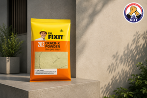 Dr. Fixit Crack-X Powder mixed with water and filled into a plaster wall crack
