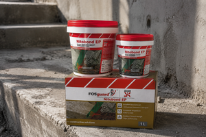 Fosroc Nitobond EP epoxy bonding agent tubs and 1L box on concrete steps

