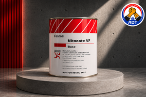 Epoxy putty Nitocote VF being applied to honeycombed concrete surface — void filling defect repair substrate preparation India

